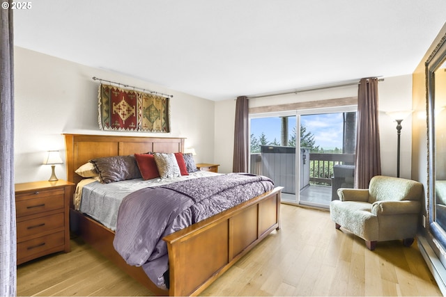 2801 Willows Rd Unit 1, Seaview, WA 98644 - bedroom with access to outside, light wood-type flooring, and baseboard heating