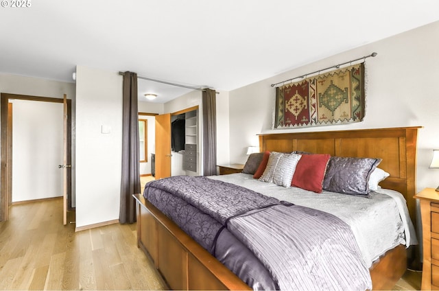2801 Willows Rd Unit 1, Seaview, WA 98644 - bedroom with light wood-style floors and a closet