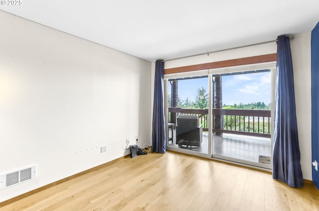 2801 Willows Rd Unit 1, Seaview, WA 98644 - spare room featuring wood finished floors and baseboards