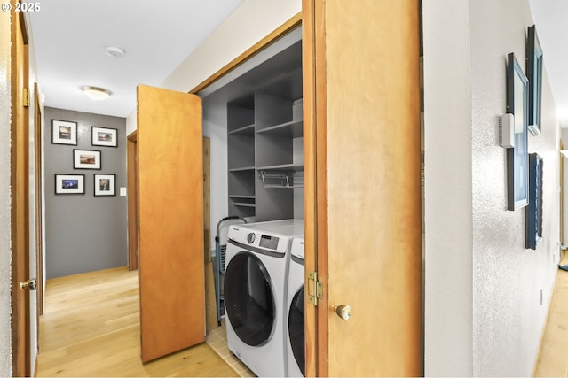2801 Willows Rd Unit 1, Seaview, WA 98644 - laundry area with washer and dryer and light wood-type flooring