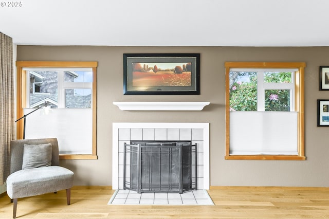 2801 Willows Rd Unit 1, Seaview, WA 98644 - living area featuring wood finished floors and a fireplace