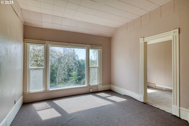 644 4th St, Myrtle Point, OR 97458 - carpeted empty room with baseboards and vaulted ceiling