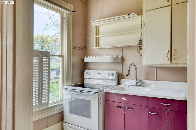 644 4th St, Myrtle Point, OR 97458 - kitchen featuring open shelves, light countertops, red cabinetry, and white electric range oven