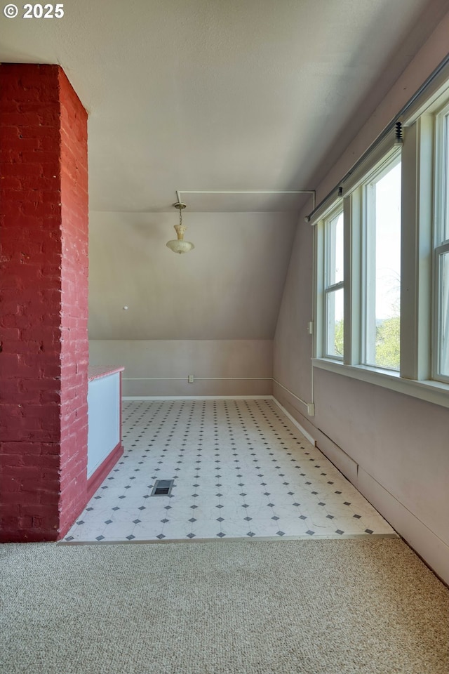 644 4th St, Myrtle Point, OR 97458 - additional living space with visible vents, lofted ceiling, and carpet floors