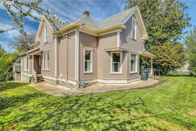 644 4th St, Myrtle Point, OR 97458 - back of house featuring roof with shingles, a yard, and a chimney
