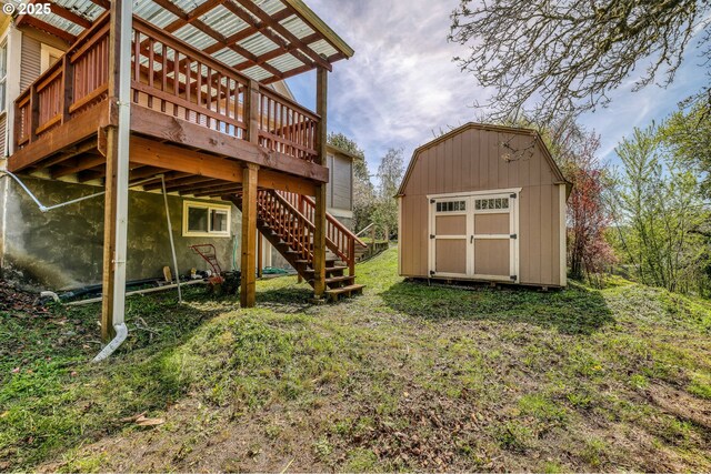 644 4th St, Myrtle Point, OR 97458 - view of yard featuring an outdoor structure, stairs, a wooden deck, and a storage unit