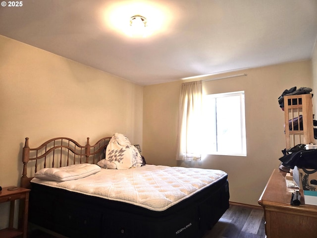 bedroom featuring dark wood-type flooring