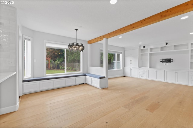 19338 Inishbride Ct, Oregon City, OR 97045 - unfurnished dining area with light wood-style flooring, a chandelier, beamed ceiling, and recessed lighting