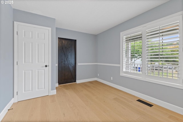 19338 Inishbride Ct, Oregon City, OR 97045 - unfurnished bedroom featuring light wood-type flooring and a closet