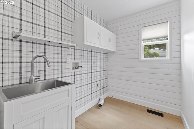 19338 Inishbride Ct, Oregon City, OR 97045 - laundry room with cabinet space, hookup for a washing machine, and light wood-type flooring