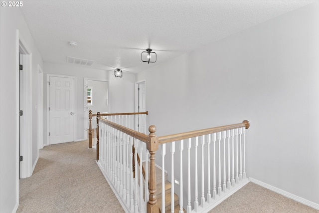 19338 Inishbride Ct, Oregon City, OR 97045 - hall featuring an upstairs landing, carpet floors, and a textured ceiling