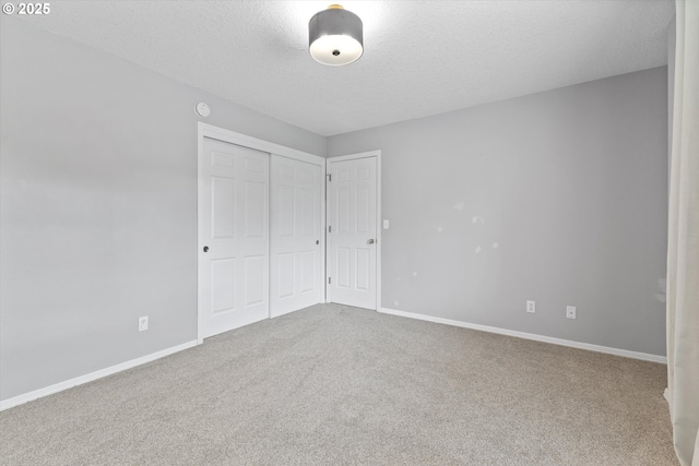 19338 Inishbride Ct, Oregon City, OR 97045 - unfurnished bedroom with a textured ceiling, carpet, and a closet