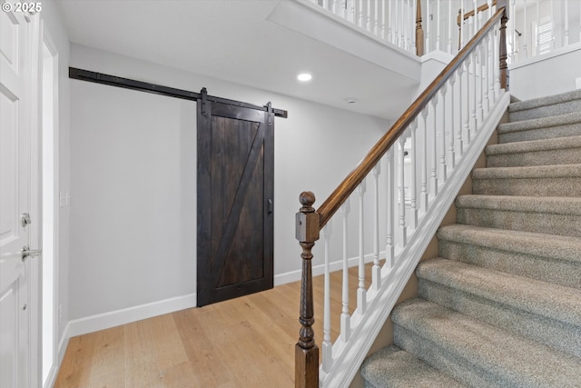 19338 Inishbride Ct, Oregon City, OR 97045 - entrance foyer with light wood-style floors, recessed lighting, stairs, and a barn door