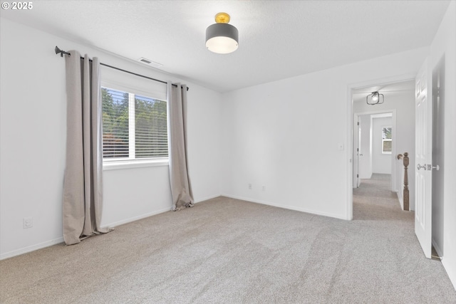 19338 Inishbride Ct, Oregon City, OR 97045 - empty room with plenty of natural light and carpet floors