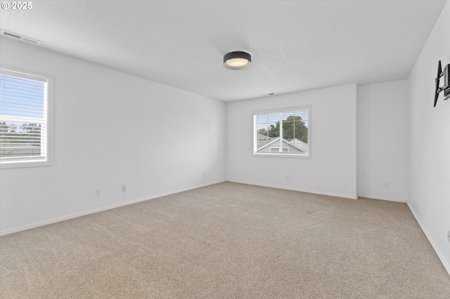 19338 Inishbride Ct, Oregon City, OR 97045 - empty room with light colored carpet and a textured ceiling