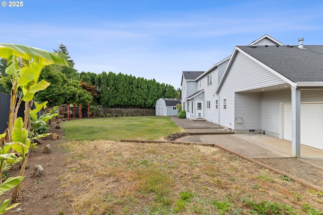 19338 Inishbride Ct, Oregon City, OR 97045 - fenced backyard with a shed, a patio, and an attached garage