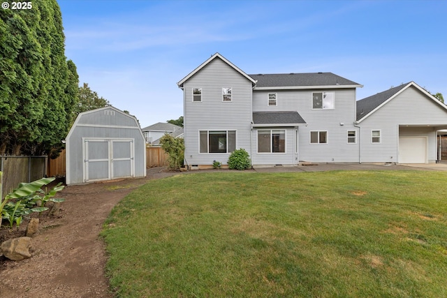 19338 Inishbride Ct, Oregon City, OR 97045 - back of house featuring a storage unit, an attached garage, and a shingled roof