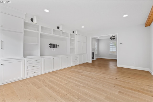 19338 Inishbride Ct, Oregon City, OR 97045 - unfurnished living room featuring light wood-type flooring, recessed lighting, and a chandelier