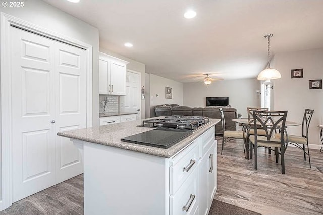 715 Shadowwood Loop, Keizer, OR 97303 - kitchen featuring ceiling fan, dark wood finished floors, a center island, white cabinets, and recessed lighting