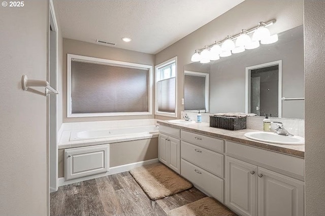 715 Shadowwood Loop, Keizer, OR 97303 - full bath featuring double vanity, wood finished floors, and a bath