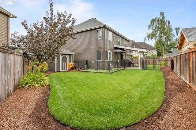 715 Shadowwood Loop, Keizer, OR 97303 - rear view of house with a fenced backyard and a storage shed