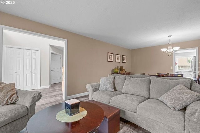 715 Shadowwood Loop, Keizer, OR 97303 - living room featuring a chandelier and wood finished floors