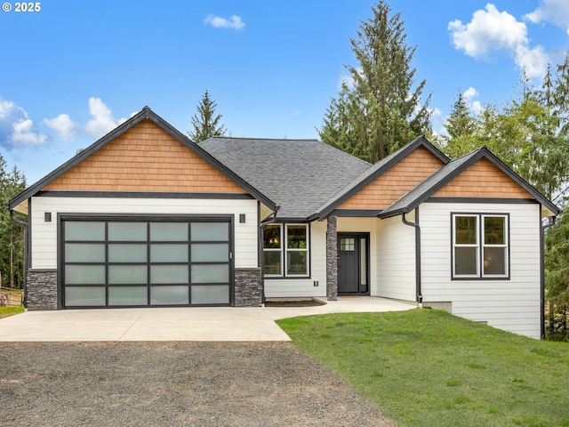 37330 Labiske Ln, Astoria, OR 97103 - craftsman-style house featuring asphalt driveway, a garage, a front lawn, roof with shingles, and stone siding