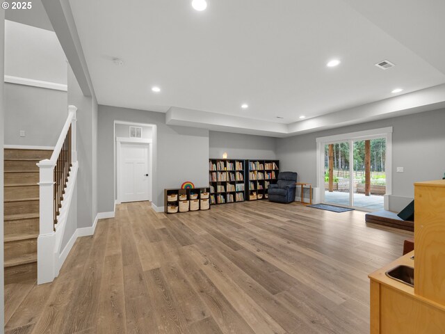 37330 Labiske Ln, Astoria, OR 97103 - living area featuring stairs, light wood-type flooring, recessed lighting, and baseboards