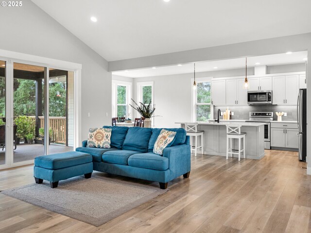 37330 Labiske Ln, Astoria, OR 97103 - living room with healthy amount of natural light, recessed lighting, light wood-type flooring, and high vaulted ceiling