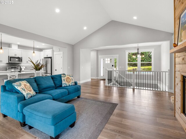 37330 Labiske Ln, Astoria, OR 97103 - living area featuring wood finished floors, high vaulted ceiling, and recessed lighting