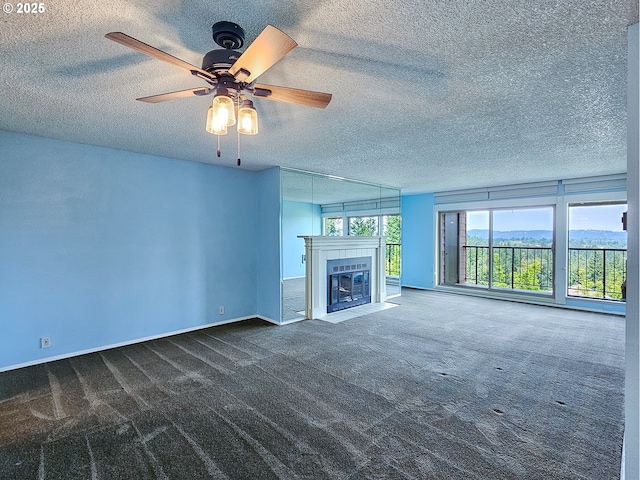 213 Oswego, Lake Oswego, OR 97035 - unfurnished living room with dark colored carpet, a fireplace, a textured ceiling, and ceiling fan