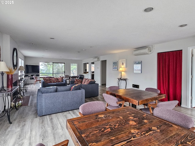 213 Oswego, Lake Oswego, OR 97035 - dining area featuring a wall mounted air conditioner, light wood-style floors, and recessed lighting