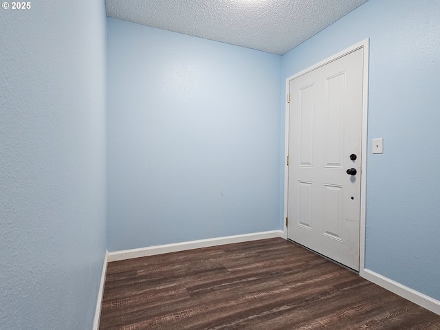 213 Oswego, Lake Oswego, OR 97035 - foyer with dark wood-style flooring and a textured ceiling