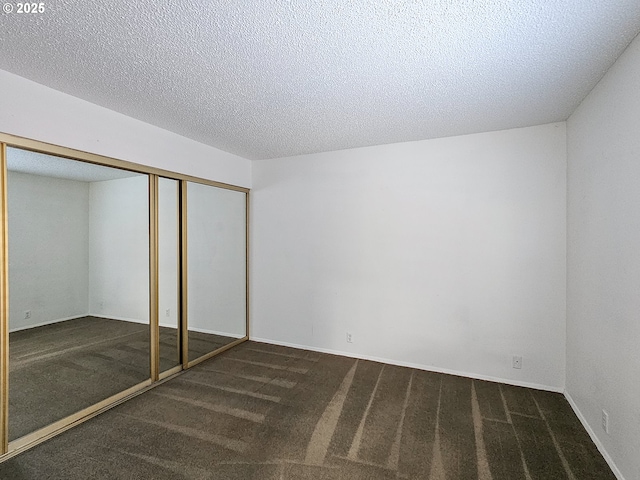 213 Oswego, Lake Oswego, OR 97035 - unfurnished bedroom featuring carpet, a textured ceiling, and a closet