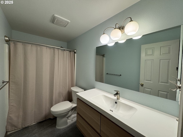 full bathroom featuring vanity, a shower with curtain, visible vents, toilet, and tile patterned floors