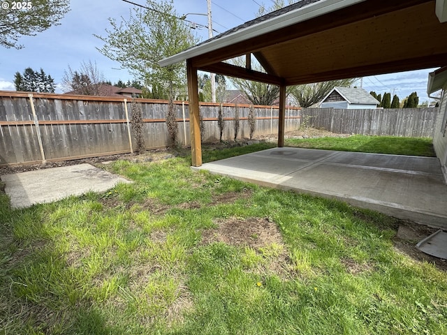 view of yard featuring a patio area and a fenced backyard