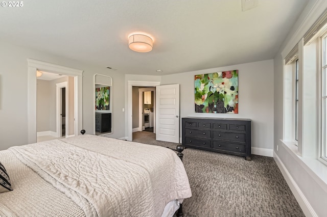 carpeted bedroom featuring baseboards and visible vents