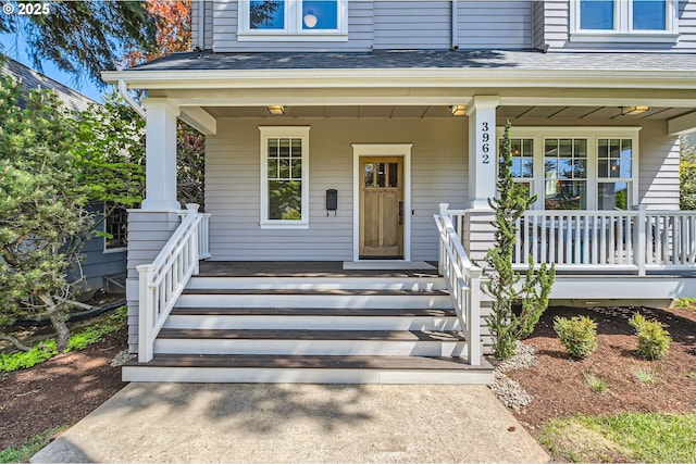 view of exterior entry with a porch
