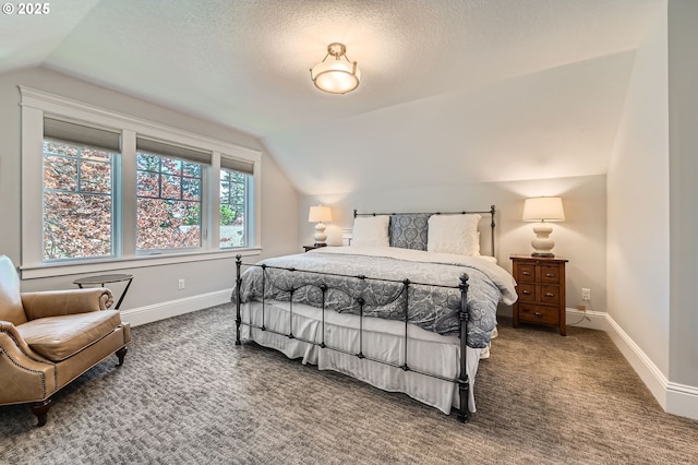 bedroom featuring carpet flooring, baseboards, and vaulted ceiling
