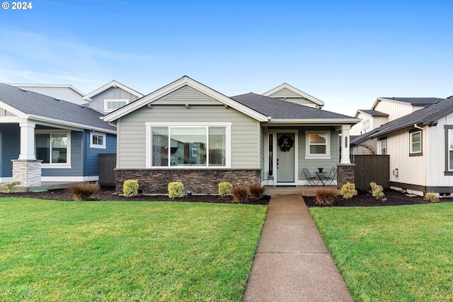 craftsman-style house with a front lawn