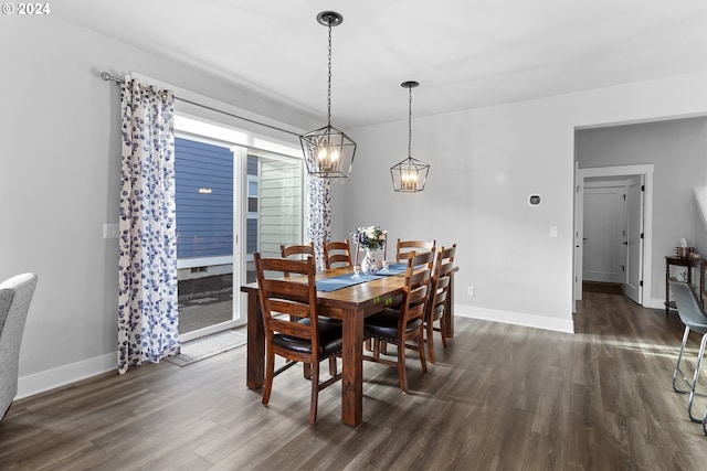 dining area featuring a chandelier and dark hardwood / wood-style floors