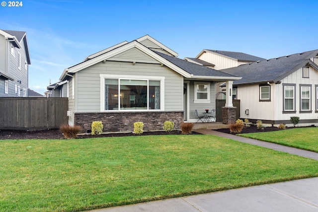 craftsman-style house with a front yard