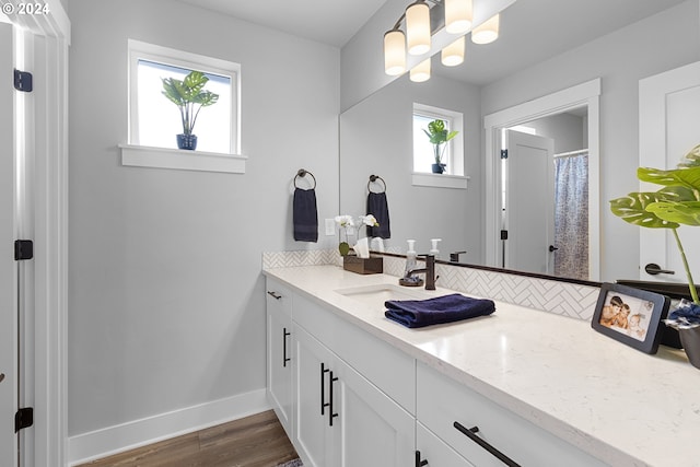 bathroom featuring hardwood / wood-style floors and vanity