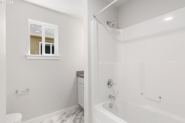 full bathroom featuring toilet, vanity, and bathing tub / shower combination