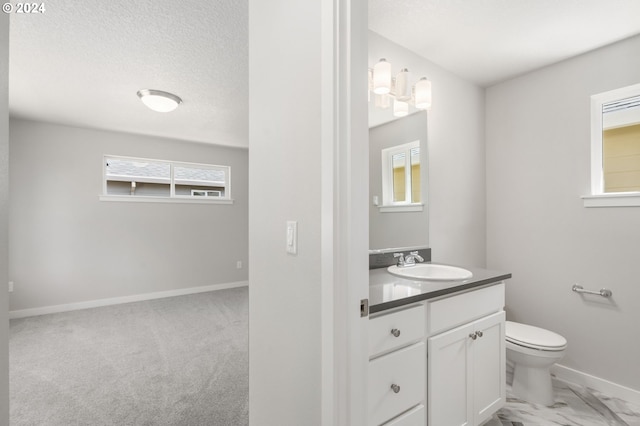 bathroom featuring toilet and vanity