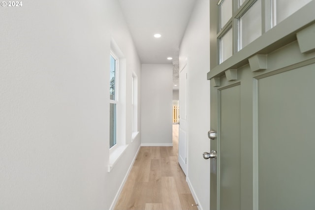 hall with light hardwood / wood-style flooring