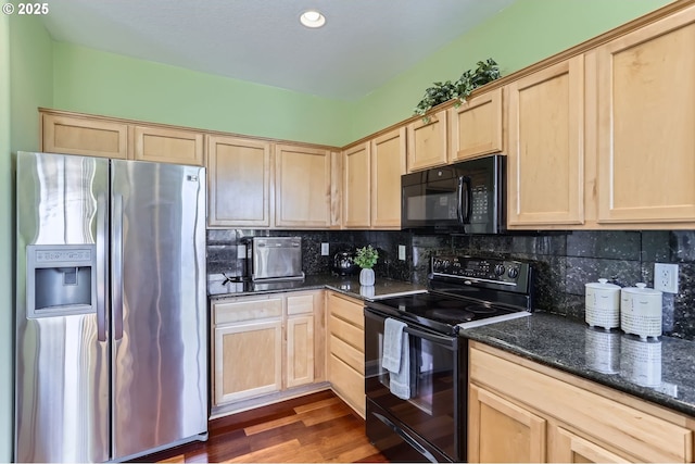 kitchen with black appliances, light brown cabinetry, dark stone counters, dark wood finished floors, and recessed lighting