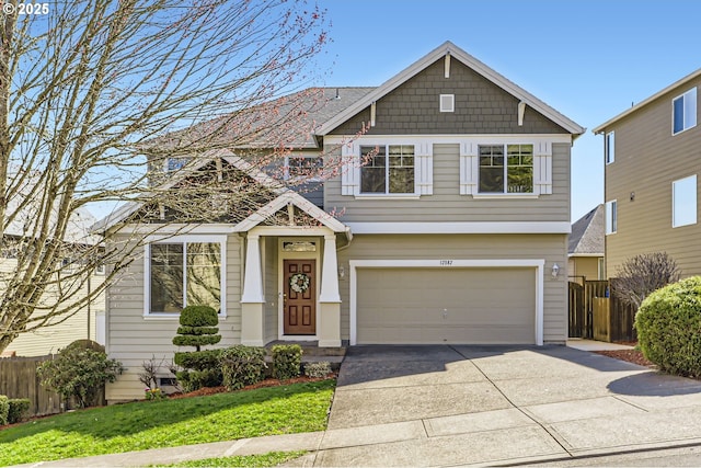 craftsman-style home featuring driveway and a garage