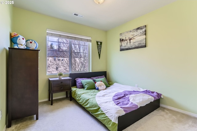 bedroom with carpet and baseboards