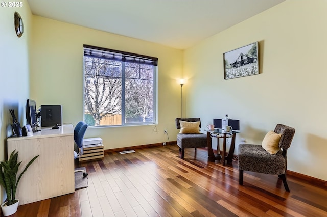 office with baseboards and dark wood-style flooring